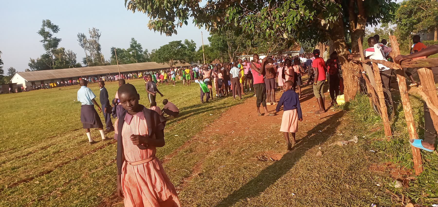 Pupils gathering across a school field