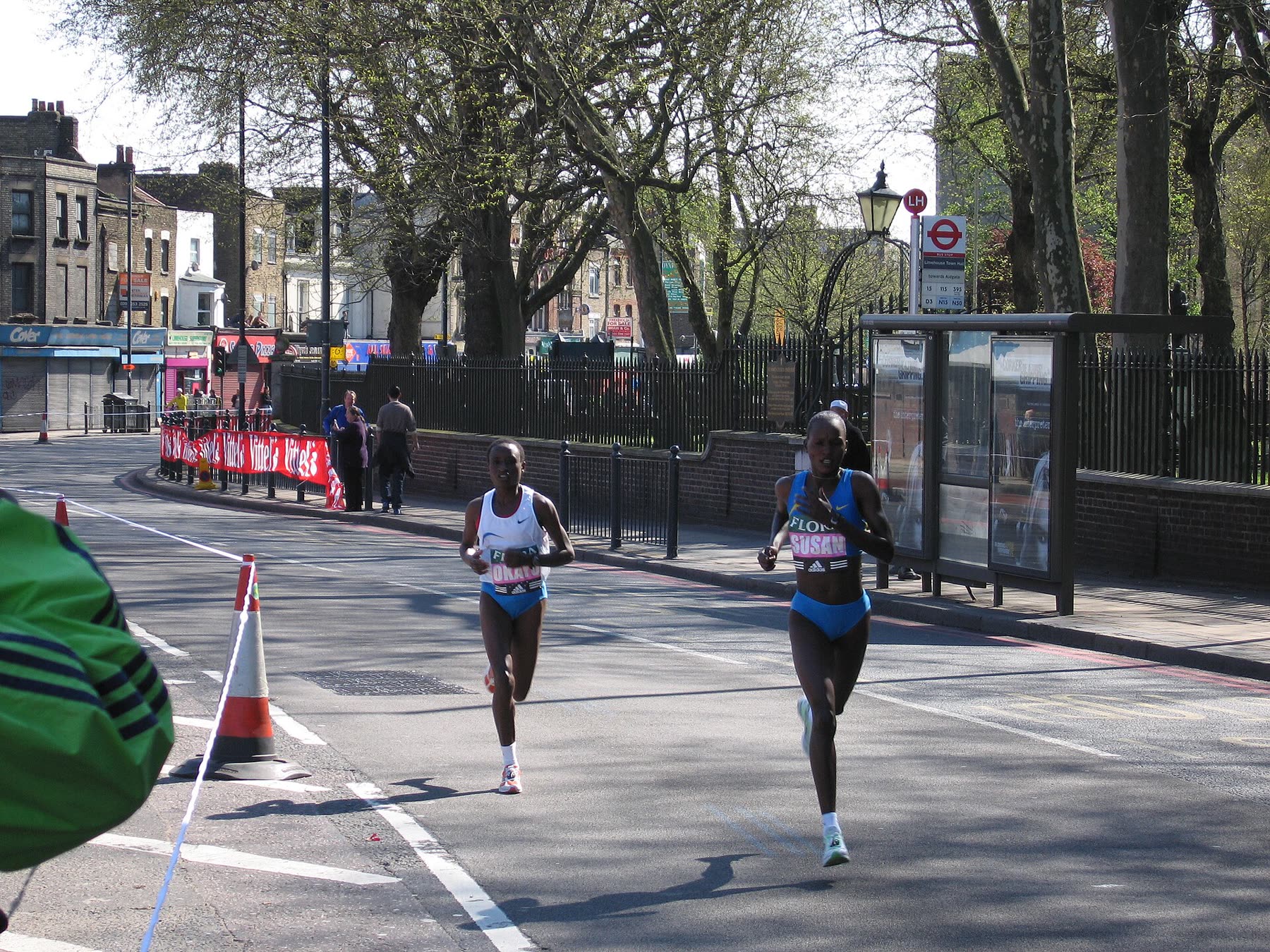 Two women runners on a city street during a marathon
